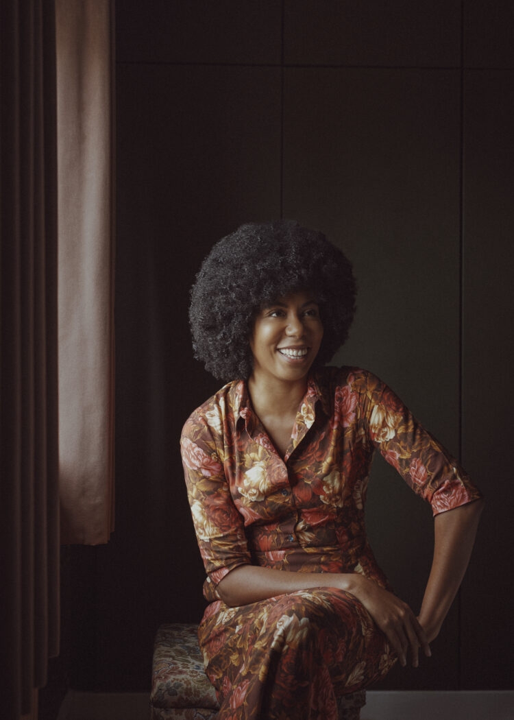 Laura Hunger portrait sitting down