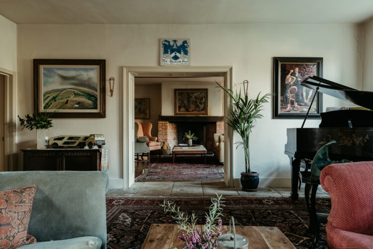 Living room with couches and grand piano