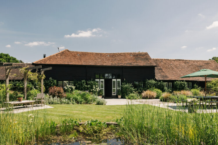 The exterior of Kings Ash Barn as seen from the beautiful main garden.