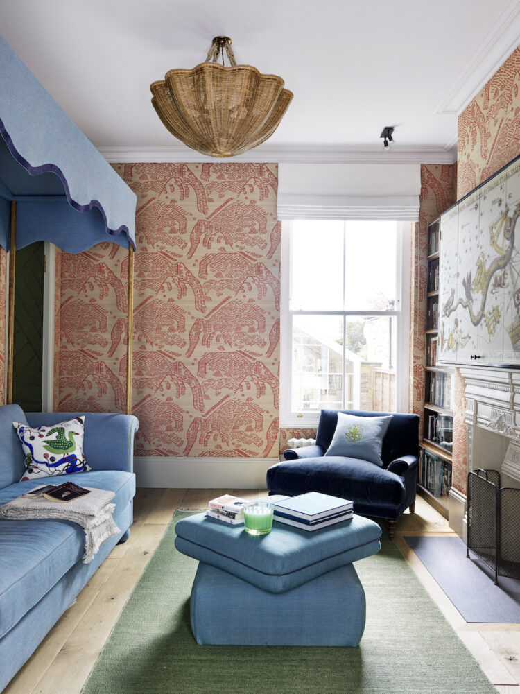 Bedroom with blue day bed and pink patterned wallpaper