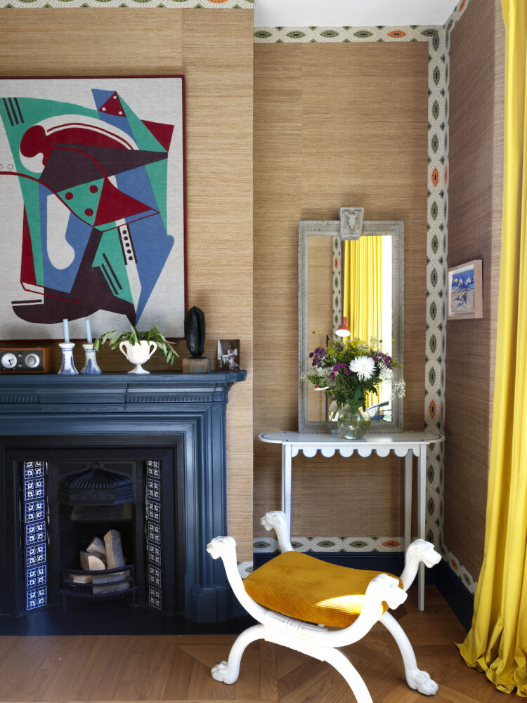 Sitting Room with textured wall paper and blue fireplace