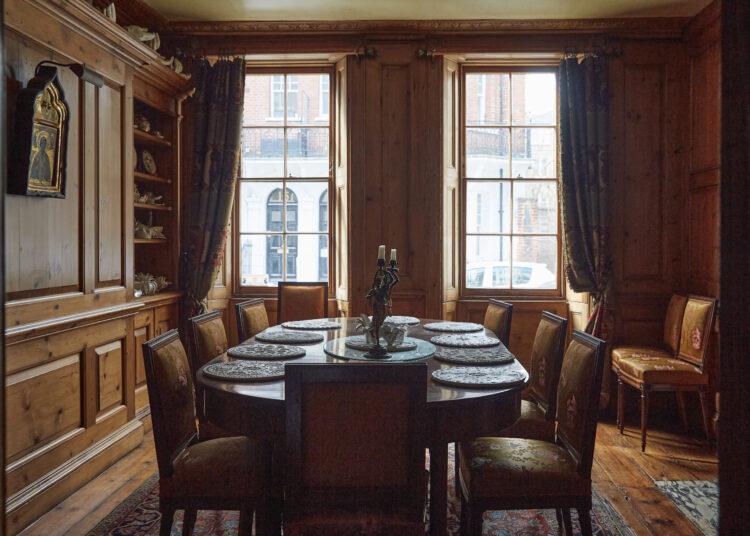 Dining Room with wooden panelled walls