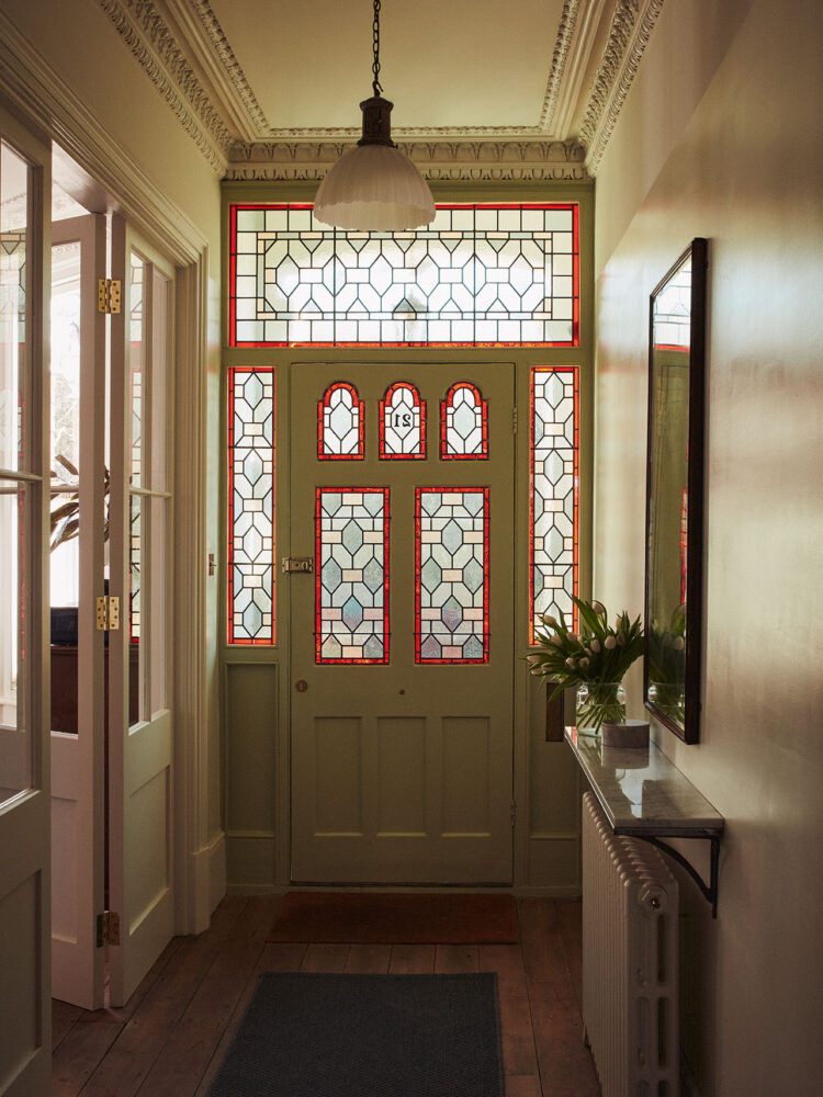 Hallway with stained glass front door