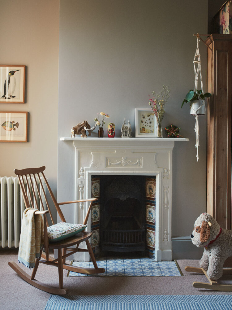 Child's bedroom with fireplace and rocking chair