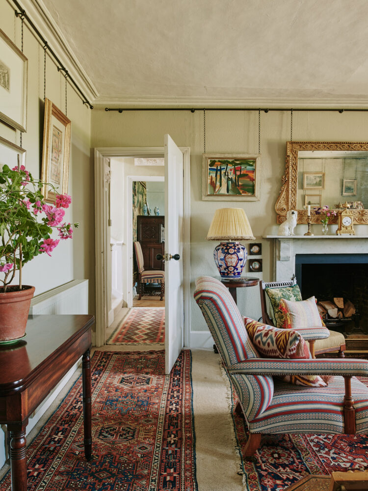 View of sitting room with wooden panelled walls painted green