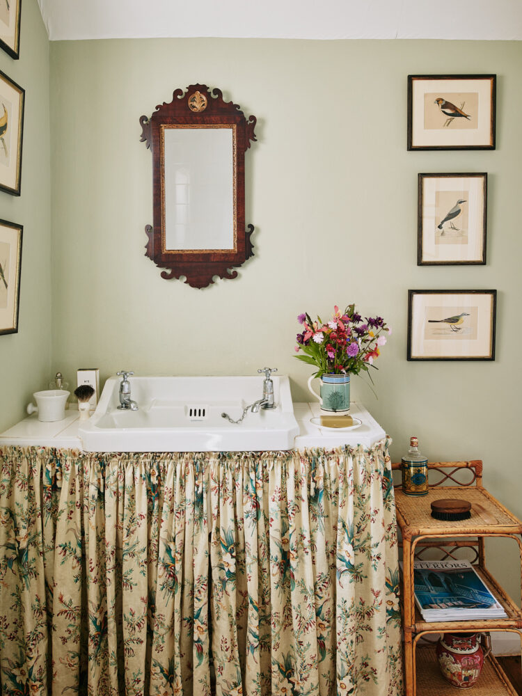 Bathroom with floral skirting under basin
