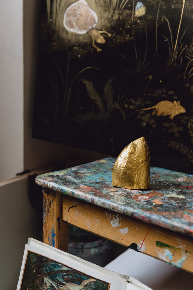 Artist table with gold fish head